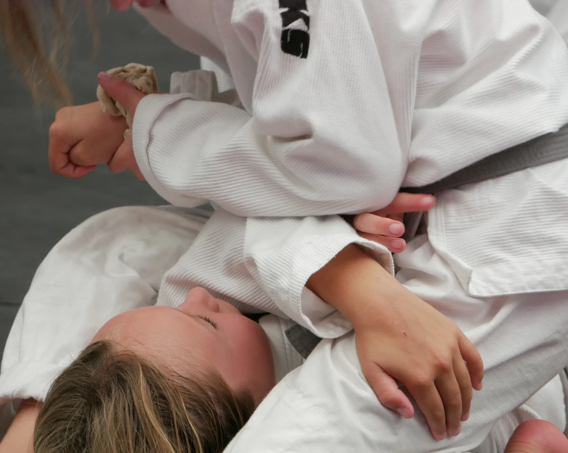 Kids having a bjj rolling match